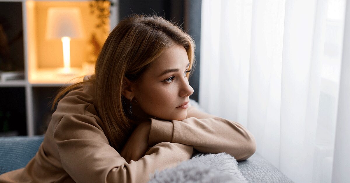Someone thinking about pregnancy symptoms she's experiencing after taking the abortion pill