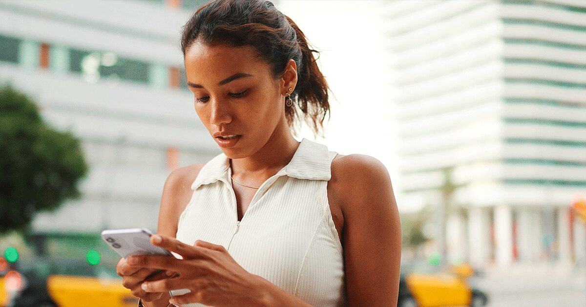A woman researching abortion pills from online sources on her phone before making a pregnancy decision.