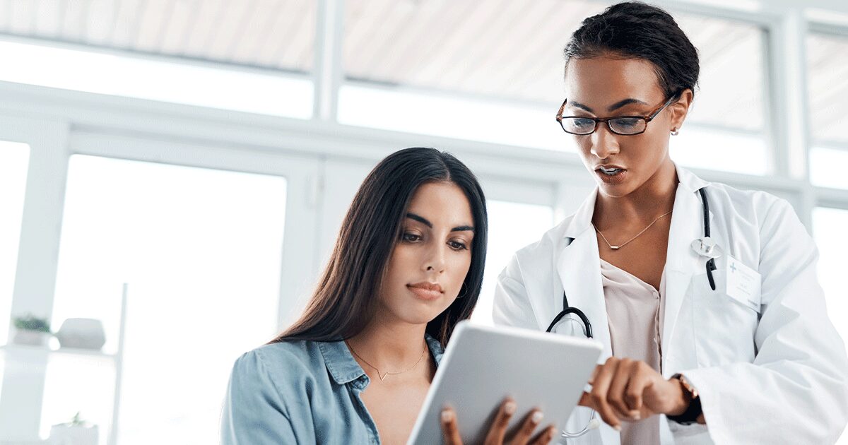 Healthcare provider discussing follow-up care after the abortion pill with a patient.