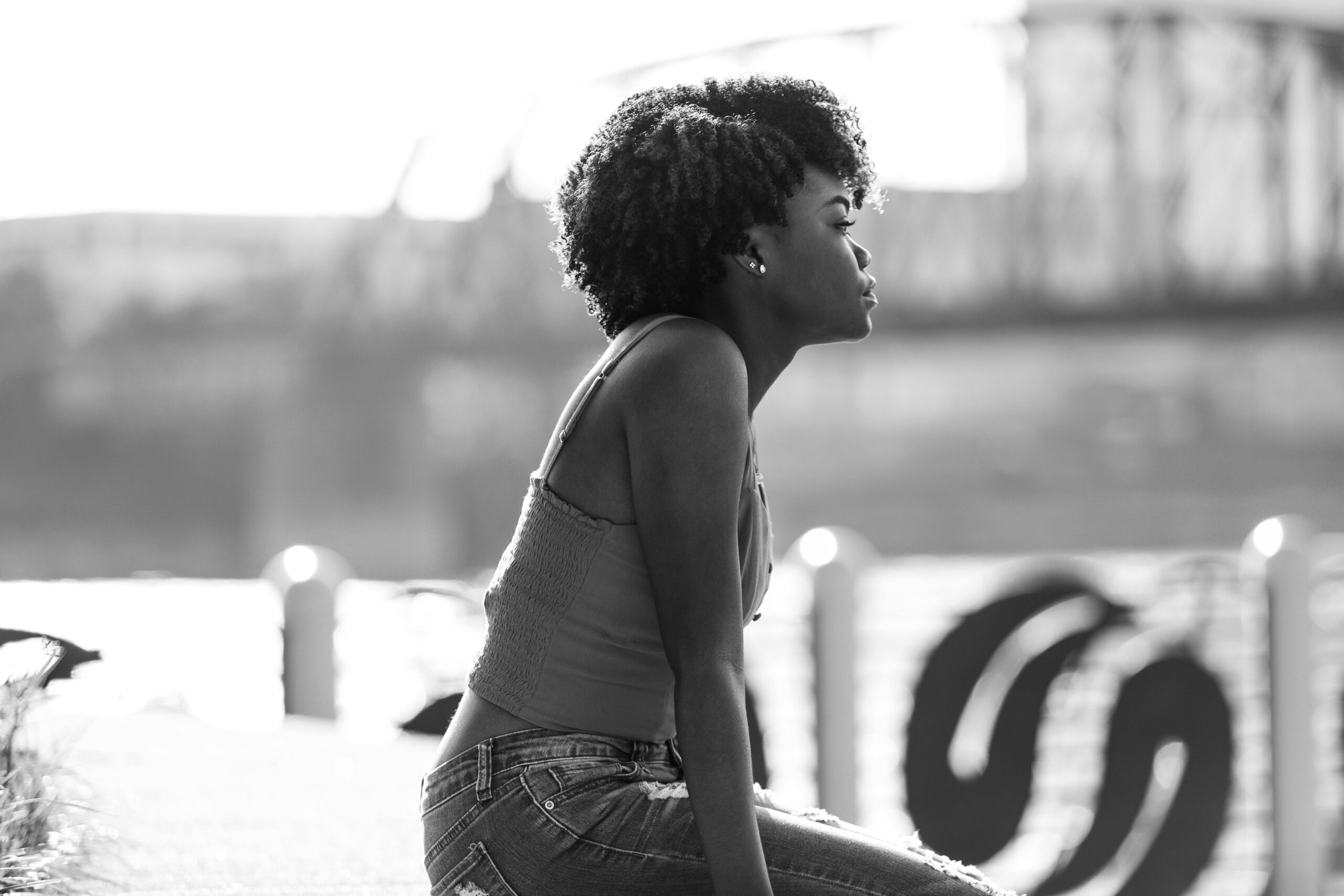 A thoughtful young woman gives herself space to consider whether she is ready to make a pregnancy decision.